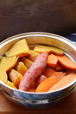 Pile of Steamed Tricolor Sweet Potatoes in a Steaming Pot