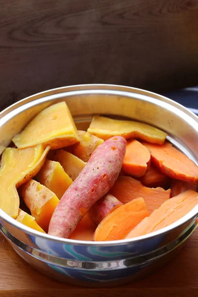 Pile of Steamed Tricolor Sweet Potatoes in a Steaming Pot