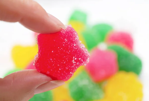 Woman Picking Delectable Hot Pink Sugar Coated Soft Jelly Candy — Stock Photo, Image