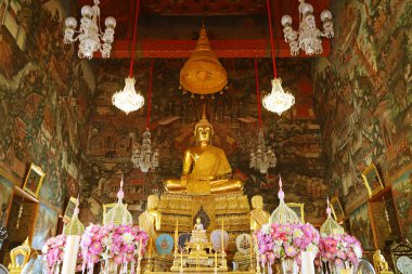 Beautiful Main Buddha Image with Amazing Murals Inside the Ordination Hall of Wat Arun or The Temple in Bangkok, Thailand clipart