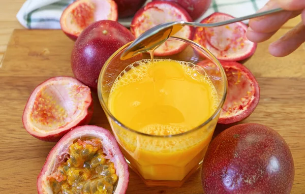 Adding Honey Sweeten Freshly Squeezed Passion Fruit Juice — Stock Photo, Image