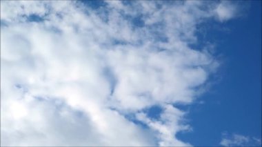 Time Lapse Footage of White Fluffy Clouds Flowing on Blue Sunny Sky