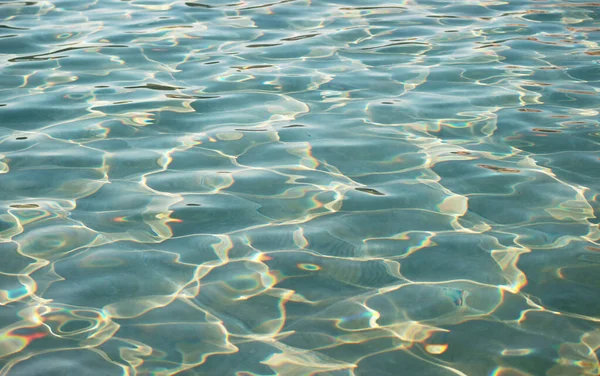 stock image Artistic patterns of water surface in the pool reflecting with the sunlight