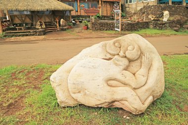 Impressive Stone Carving on the Sidewalk of Hanga Roa Town on Easter Island, Chile, South America clipart