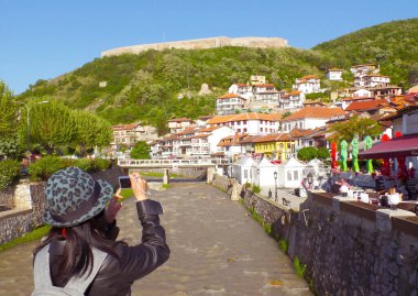 Visitor Taking Photo of the Amazing Cityscape of Prizren Old City, Kosovo clipart