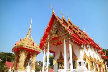 Fantastic Ordination Hall with the Sema Arch in the Foreground of Wat Chomphuwek Buddhist Temple, Nonthaburi Province, Thailand clipart