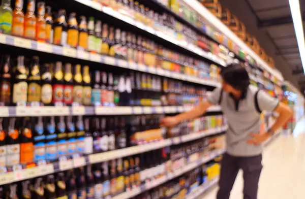 stock image Abstract blurred of a man shopping liquor in a grocery store