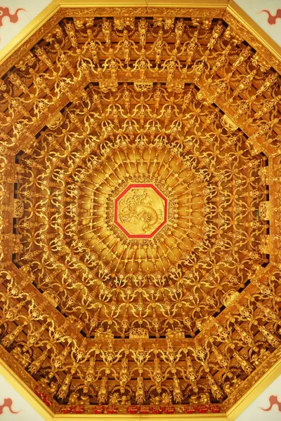 stock image Incredible Golden Chinese Phoenix Wood Carving on the Ceiling of a Chinese Buddhist Temple