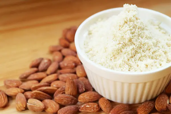 Stock image Bowl of almond flour, finely ground almonds for gluten free baking ingredient