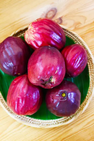 stock image Basket of Fresh Ripe Deep Red Malay Apples Called Chompu Mameaw in Thailand