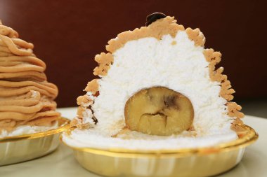 Mouthwatering Whipped Cream and Sweetened Chestnut Inside a Mont Blanc Cake clipart