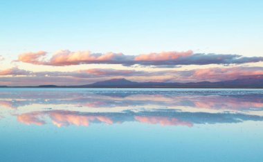 Stunning Mirror Effect of Salar de Uyuni or Uyuni Salts Flats at the End of Rainy Season, UNESCO World Heritage Site in Bolivia, South America clipart