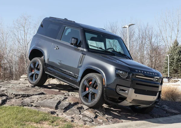 stock image Indianapolis - Circa December 2022: Land Rover Defender display at a dealership. Land Rover offers the Defender in base, SE, V8 and Carpathian models.