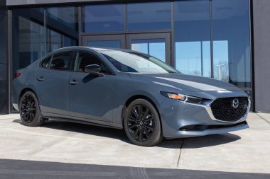 Cincinnati - Circa February 2023: Mazda 3 display at a dealership. Mazda offers the Mazda 3 in a sedan or hatchback.