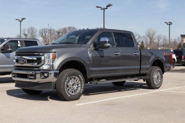 Fishers - Circa February 2023: Ford F-250 display at a dealership. The Ford F250 is available in XL, XLT, Lariat, King Ranch, and Platinum models.