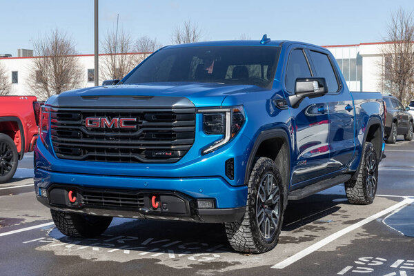 Carmel - Circa March 2023: GMC Sierra 1500 pickup display at a dealership. GMC offers the Sierra in HD, HD Pro, AT4 and Denali models.