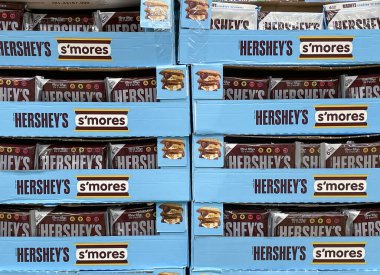 Indianapolis - Circa April 2023: Hershey's Milk Chocolate display. Hershey's Chocolate is an ingredient in s'mores. clipart