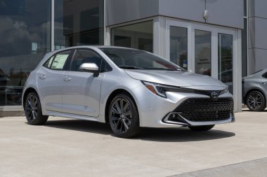 Whitestown - June 24, 2023: Toyota Corolla Hatchback display at a dealership. Toyota offers the Corolla Hatchback in SE and XSE models. clipart