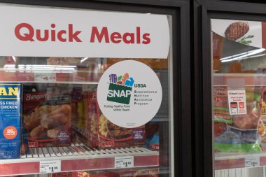 Muncie - July 10, 2023: We Welcome SNAP Benefits sign. SNAP and Food Stamps provide nutrition benefits to assist disadvantaged families. clipart