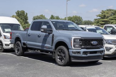 Kokomo - August 27, 2023: Ford F-350 Crew Cab display at a dealership. The Ford F350 is available in XLT, Lariat, King Ranch, and Platinum models. clipart