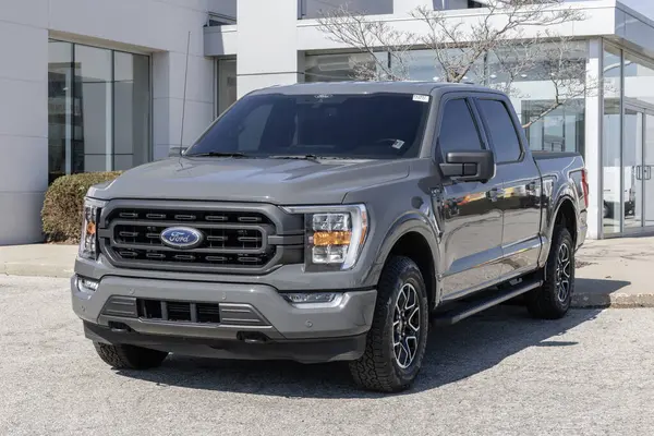 Stock image Fishers - February 3, 2024: Used Ford F-150 display at a dealership. With supply issues, Ford is relying on pre-owned car sales to meet demand. MY:2021