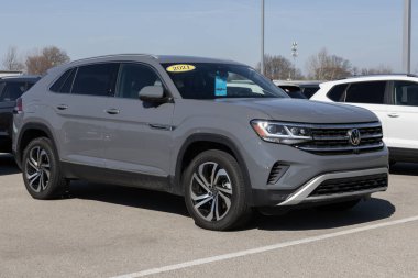 Noblesville - February 3, 2024: Used Volkswagen Atlas display at a dealership. With supply issues, VW is selling preowned cars to meet demand. MY:2021 clipart