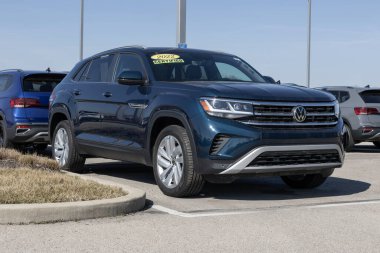 Noblesville - February 3, 2024: Certified Used Volkswagen Atlas display. With supply issues, VW is selling preowned cars to meet demand. MY:2022 clipart