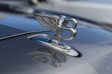 Indianapolis - March 16, 2024: Bentley Flying B hood ornament on a Mulsanne. The Bentley Flying B dates back to 1933. MY:2017 clipart