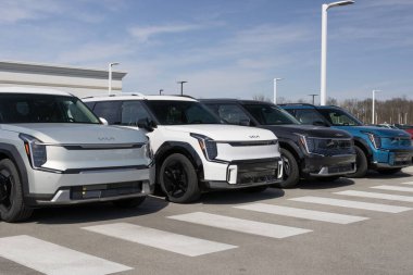 Indianapolis - March 24, 2024: Kia EV9 EV Electric Vehicle display at a dealership. Kia offers the EV9 in Light, Wind, and Land models. MY:2024 clipart