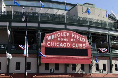 Chicago - April 6, 2024: Wrigley Field Home of Chicago Cubs in red with copy space. Wrigley Field has been home to the Cubs since 1916. clipart
