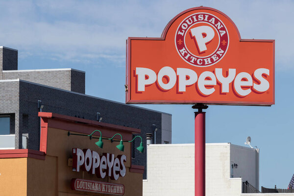 Chicago - April 6, 2024: Popeyes Louisiana Kitchen Fast Food Restaurant. Popeyes is known for its Cajun Style Fried Chicken.