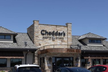 Indianapolis - April 13, 2024: Cheddar's Scratch Kitchen restaurant. Cheddar's Scratch Kitchen is owned and operated by Darden Restaurants. clipart