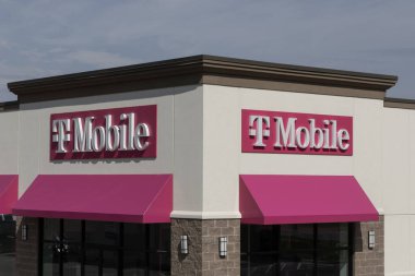 Logansport - May 2, 2024: T-Mobile cell and mobile phone store. T-Mobile offers reliable 5G Home Internet service with its fixed wireless service. clipart
