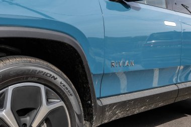 Chicago - May 12, 2024: Rivian R1S SUV display. Rivian offers the R1S in Adventure, Adventure All-Terrain and Launch editions. MY:2024 clipart