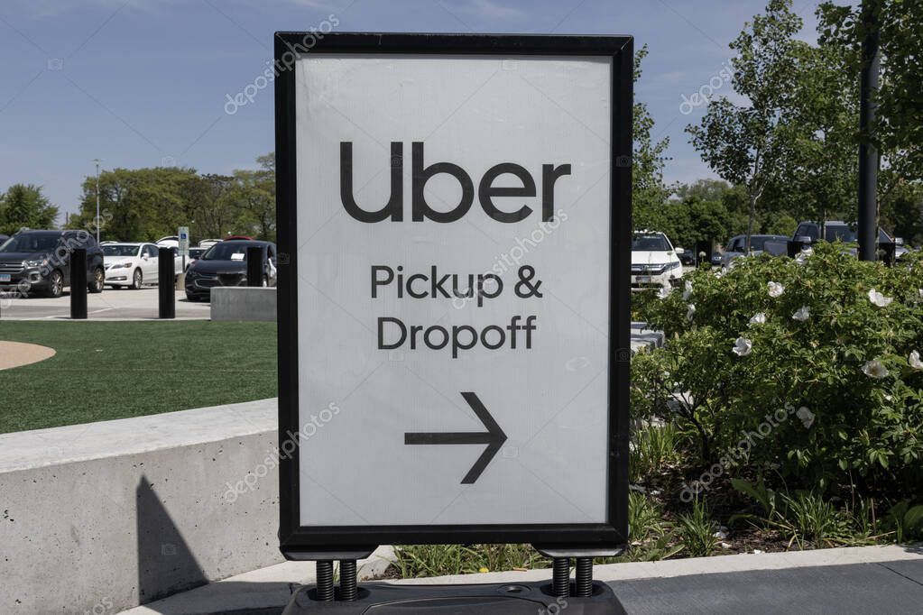 Chicago - May 12, 2024: Uber pickup and dropoff point sign. Uber and Lyft have replaced many Taxi cabs for transportation with a smart phone app.