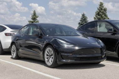 Indianapolis - May 19, 2024: Tesla Model 3 display at a dealership. Tesla offers the Model 3 with either 272, 315 or up to 358 miles per charge. MY:2023