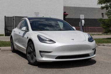 Indianapolis - May 19, 2024: Used Tesla Model 3 display at a dealership. To meet high demand, Tesla buys and sells pre-owned cars. MY:2020