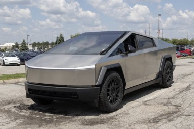 Indianapolis - May 19, 2024: Tesla Cybertruck display at a dealership. Tesla claims the Cybertruck has a driving range of up to 340 miles. MY:2024