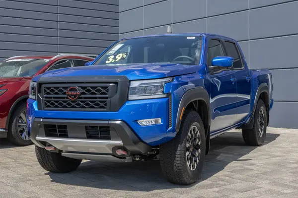 stock image Indianapolis - May 30, 2024: Nissan Frontier Pro-4X Crew Cab 4X4 display. Nissan offers the Frontier in S, SV, PRO-X and Midnight Edition. MY:2024