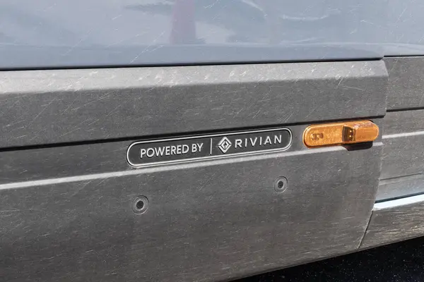 stock image Crown Point - June 27, 2024: Amazon Prime EV electric delivery vans from Rivian. With a net-zero carbon pledge, Amazon will use 100,000 EV vans by 2040.