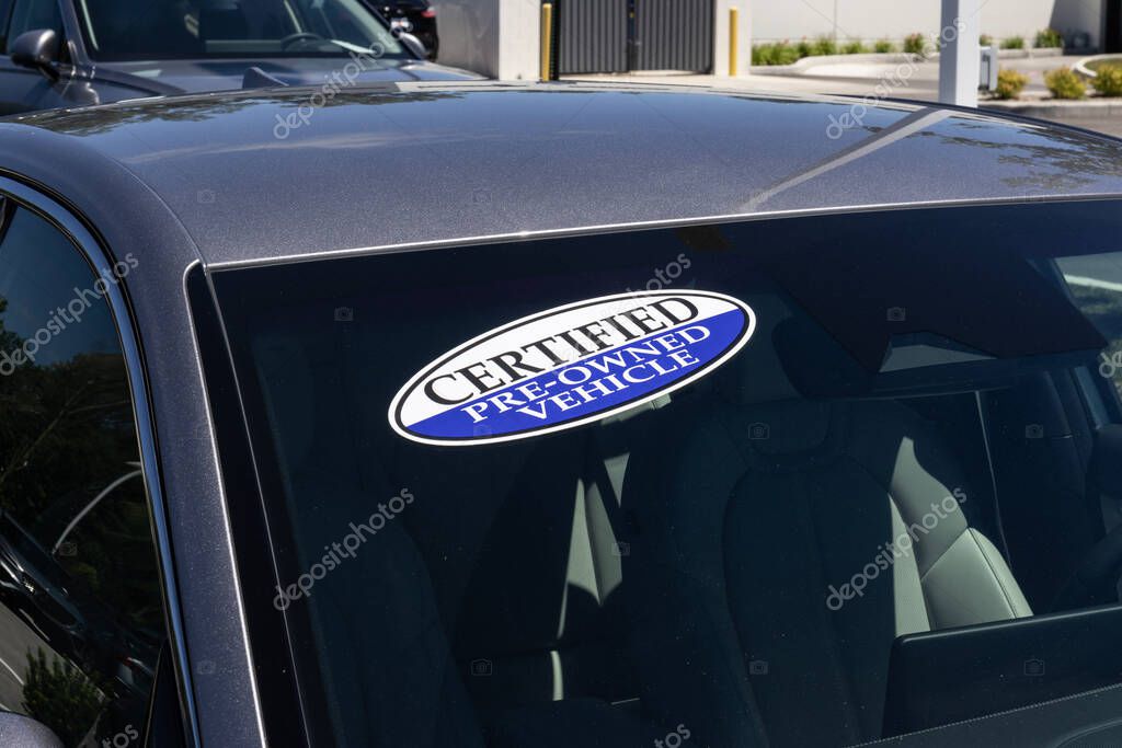 Certified Pre-Owned vehicle sign on a used car. With high price concerns, used and pre-owned vehicles are in high demand.