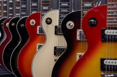 Indianapolis - July 7, 2024: Les Paul guitar display at a music store. Les Paul guitars are versatile for many music styles from Jazz to Blues to Rock. clipart