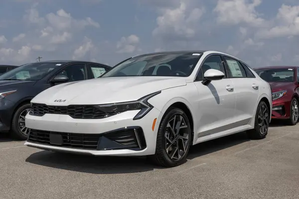 stock image Fishers - August 4, 2024: Kia K5 EX display at a dealership. Kia offers the K5 with a Direct Injection 2.5L 4-Cylinder engine. MY:2025