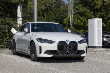 Indianapolis - August 25, 2024: BMW i4 xDrive40 display at a dealership. BMW offers the i4 as a BEV with up to a 307 mile driving range. MY:2024 clipart