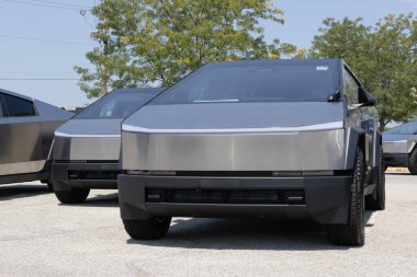 Indianapolis - August 25, 2024: Tesla Cybertruck display at a dealership. Tesla offers the Cybertruck with driving range of up to 340 miles. clipart