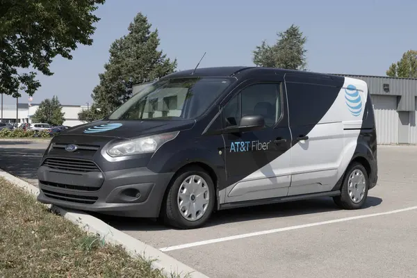 stock image Indianapolis - August 25, 2024: AT&T Work, Repair and installation vehicle. AT&T offers voice, data, cellular, mobile, fiber optics, TV and IP-based products.