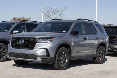 Avon - October 27, 2024: Honda Pilot AWD Trailsport SUV display at a dealership. Honda offers the Pilot with a 285HP VCM V6 engine. MY:2025 clipart