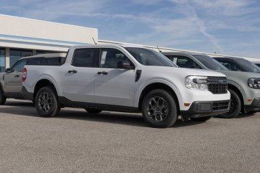 Lafayette - December 17, 2024: Ford Maverick XLT Hybrid Pickup Truck at a dealership. Ford offers the Maverick with a 2.5L Hybrid engine. MY:2024 clipart