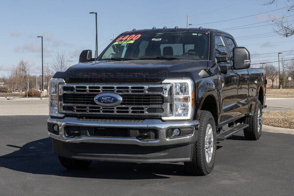 Zionsville - March 2, 2025: Ford F-250 SRW 4X4 Crew Cab pickup display at a dealership. Ford offers the F250 with a 335HP 7.3L gas V8 engine. MY:2024