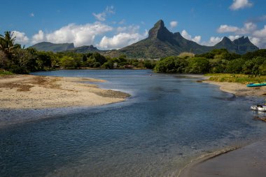 Panoramic view of the Trois Mamelles mountain from the shore of Rampart river in Tamarin, Mauritius island
